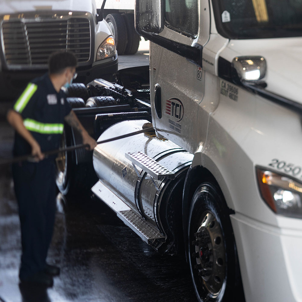 TCI maintenance crew cleaning trucks